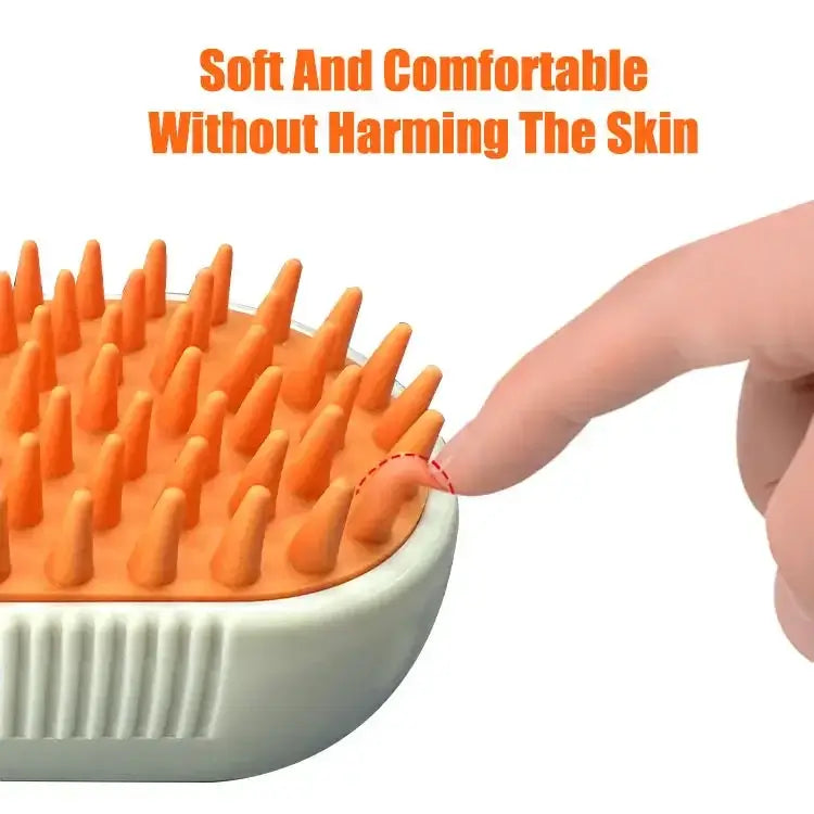 PawMist steam pet brush with orange silicone bristles and massage handle