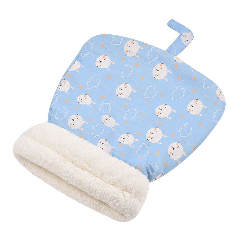 Blue cat sleeping bag with a cream-colored opening