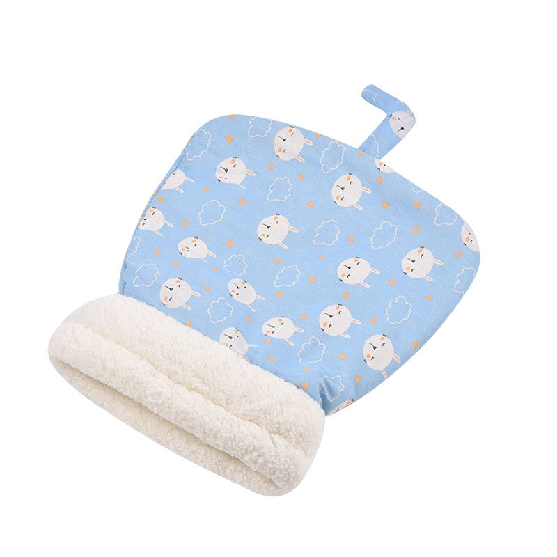 Blue polka-dot cat sleeping bag shown on a white background