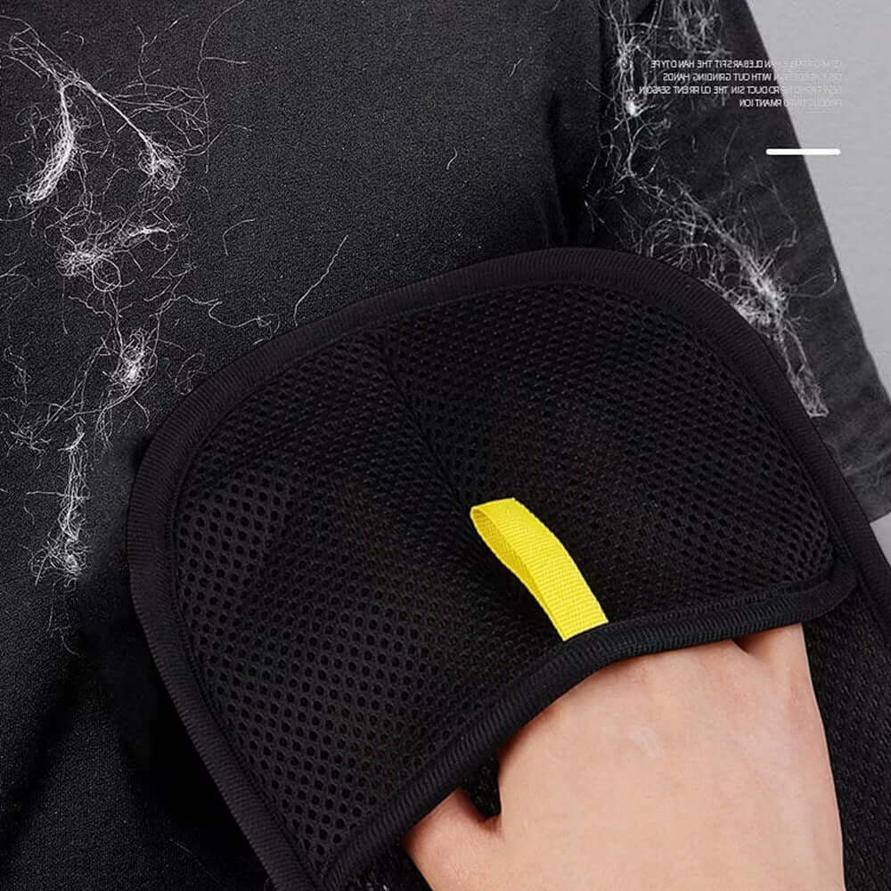 Reusable PawGlide glove lifting pet hair from black clothing