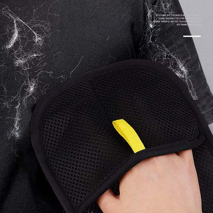 Reusable PawGlide glove lifting pet hair from black clothing