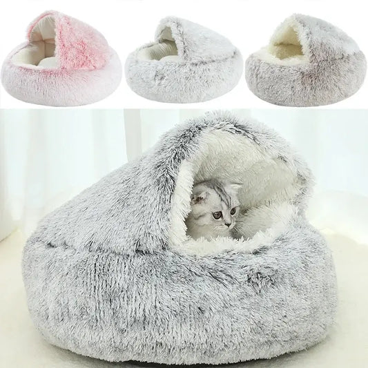 Cat curled up in gray calming pet bed with cover