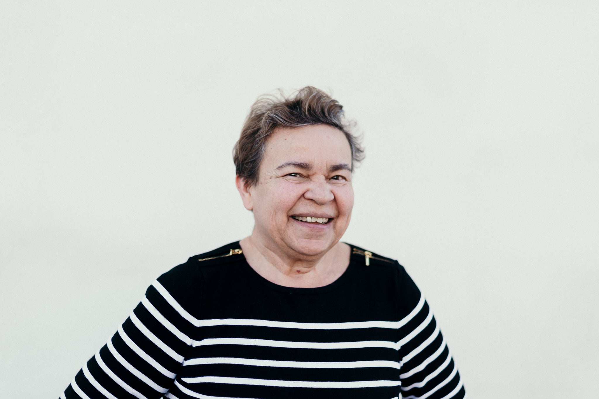 files/a-beaming-mature-woman-in-a-striped-sweater.jpg