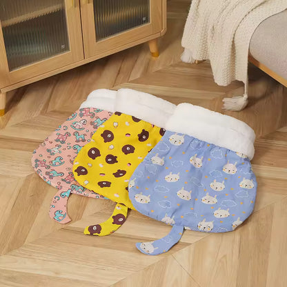 Yellow and blue patterned cat sleeping bags displayed on a wooden floor