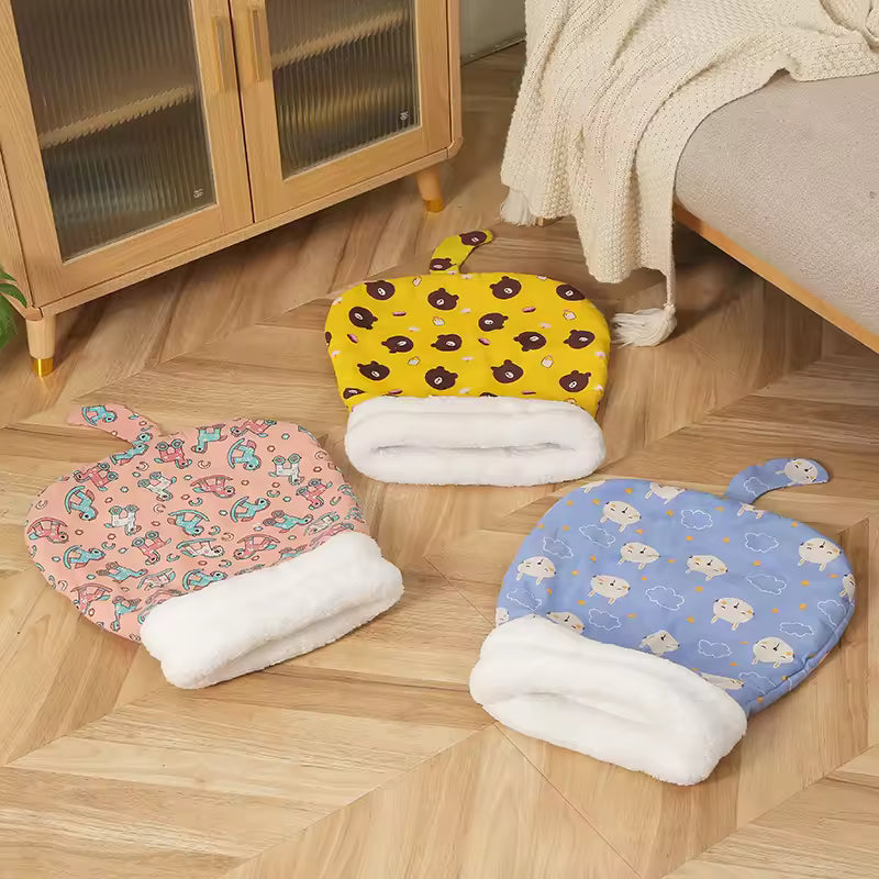 Yellow, pink and blue cat sleeping bags with cream-colored openings displayed together